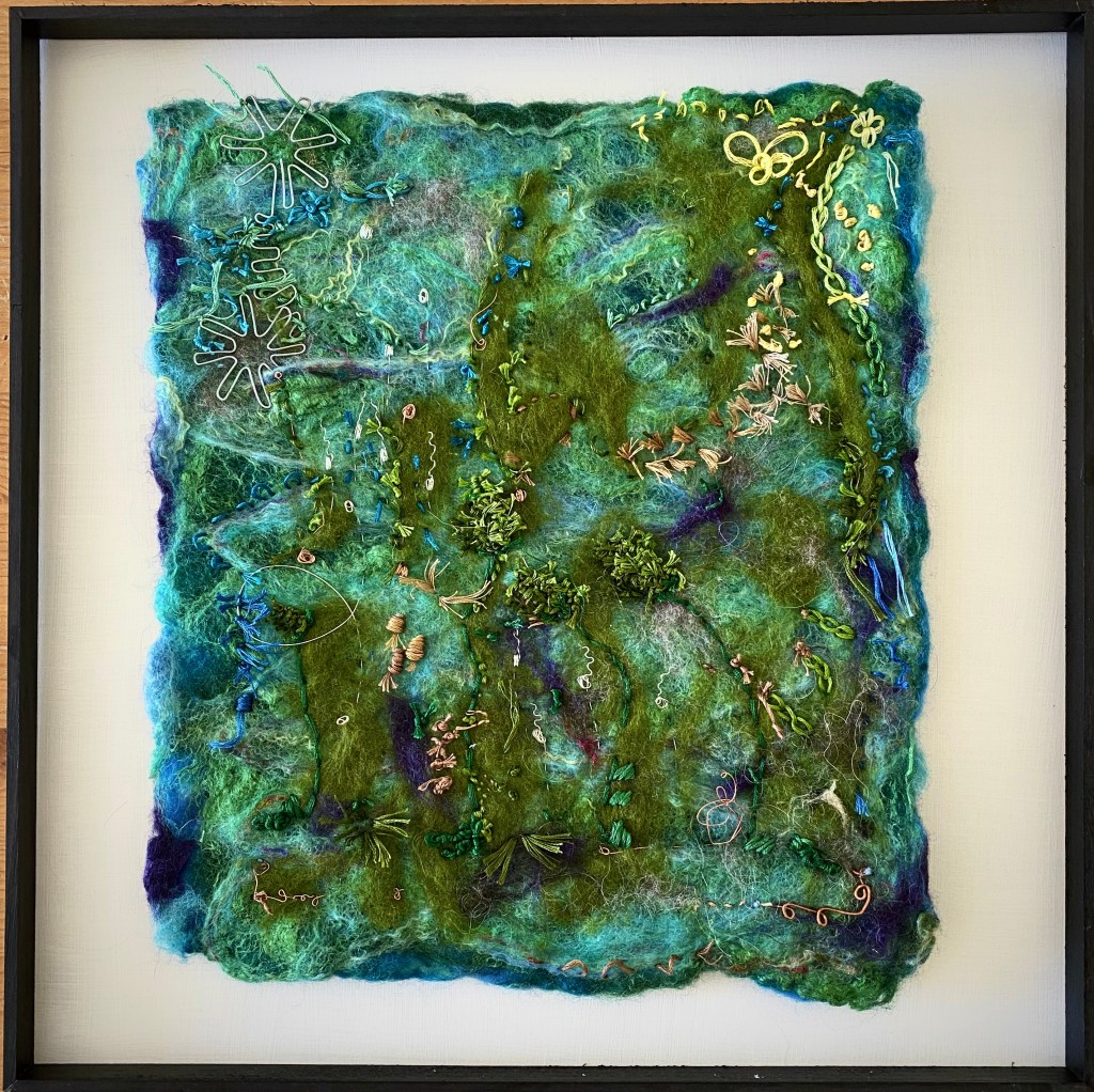 Deep Sea mixed media artwork, as shown in the Ikon Gallery Birmingham. Using the wet felting technique to create the base of the art piece for embroidery in silk, intricate silver wire work and the use of copper wire and found objects. Deep Sea is part of a series of artwork by Vicky who depicts her diving and snorkelling experiences whilst abroad on summer holidays.